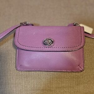 Coach Dylan Purple Mini Wallet with Turnlock Closure.